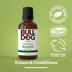 A bottle of Original Beard Oil with moisturizing Aloe Vera sits on a green background. Vegan, cruelty-free, and natural ingredient logos appear on the right. The text “Tames & Conditions” is displayed at the bottom.