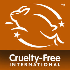 A white outline of a leaping rabbit with stars, symbolizing cruelty-free products like the Energising Collection Bundle, appears above the text Cruelty-Free International on an orange background.