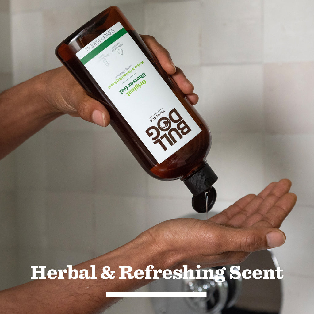 A person pours Bull Dog Moisturiser & Shower Gel Duo into their hand from a brown bottle, with “Herbal & Refreshing Scent” displayed—perfect to pair with Bulldog Skincare gifts for men.