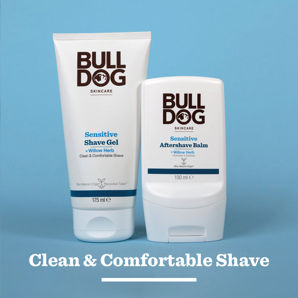 A Bulldog Sensitive Shave Gel stands upright on a blue background. The white text below reads, “Clean & Comfortable Shave for sensitive skin.”.
